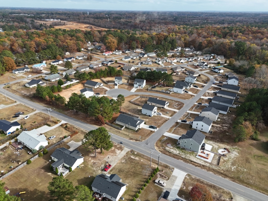 Aerial drone view of a neighborhood off Aspen Drive in Sanford, NC, showcasing the residential area during a home inspection by Realm Inspections.