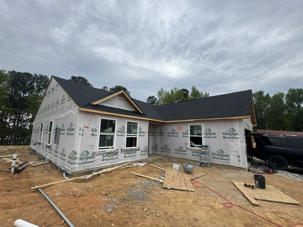 Exterior view of a new construction home during a pre-drywall inspection in the 78 North neighborhood, Sanford, NC, ensuring structural integrity and proper installation of exterior components.